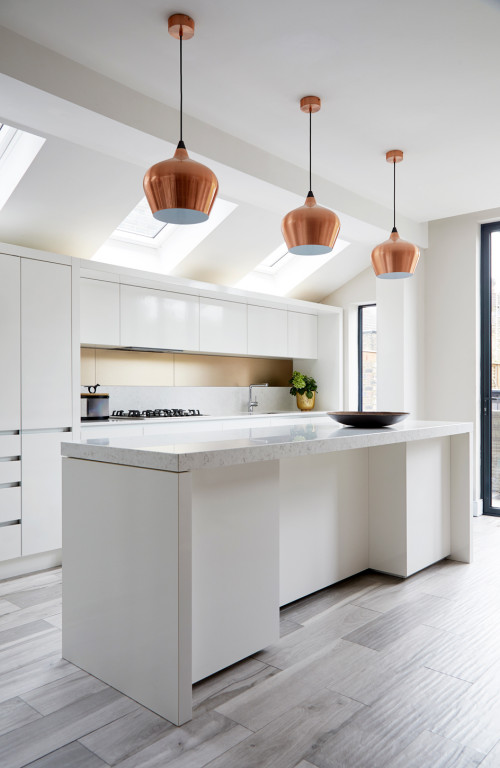 Chic and Contemporary: White Kitchen Island Ideas with White Flat-Front Cabinets, Slab Backsplash, and Dome-Shaped Copper Pendants