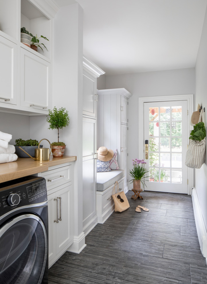 Transitional laundry room in New York.