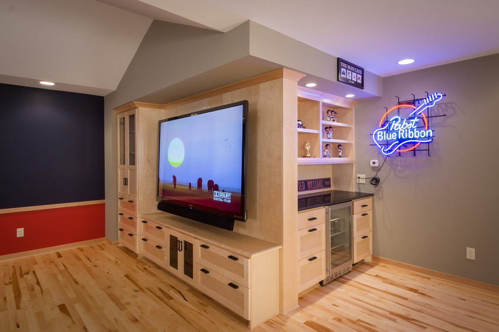 Photo of a large arts and crafts open concept family room in Minneapolis with a game room, grey walls, light hardwood floors, no fireplace and a built-in media wall.