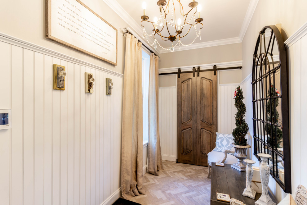 This is an example of a mid-sized traditional hallway in Other with beige walls, porcelain floors, beige floor and decorative wall panelling.