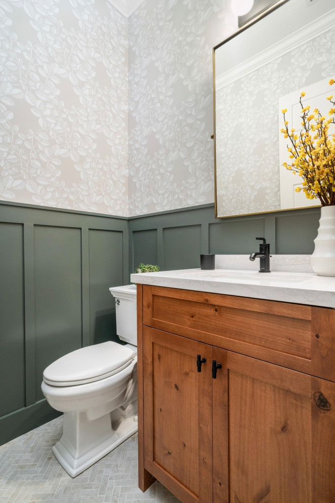 Inspiration for a craftsman porcelain tile and wainscoting powder room remodel in San Francisco with shaker cabinets, medium tone wood cabinets, a one-piece toilet, an undermount sink, quartz countertops, white countertops and a freestanding vanity