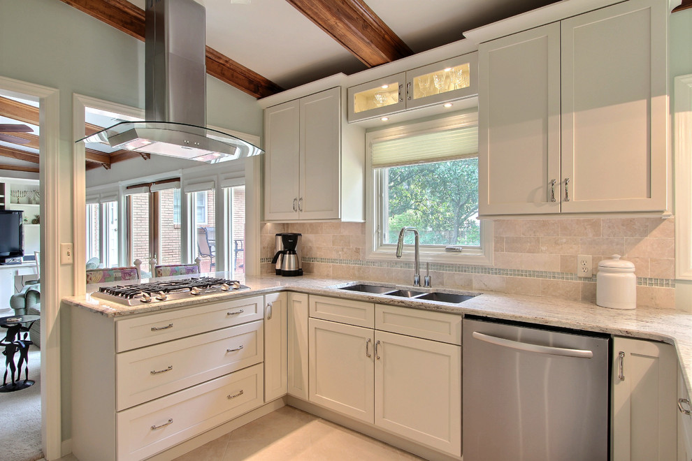 Design ideas for a mid-sized traditional u-shaped separate kitchen in Atlanta with a triple-bowl sink, shaker cabinets, white cabinets, granite benchtops, beige splashback, ceramic splashback, stainless steel appliances, travertine floors and no island.