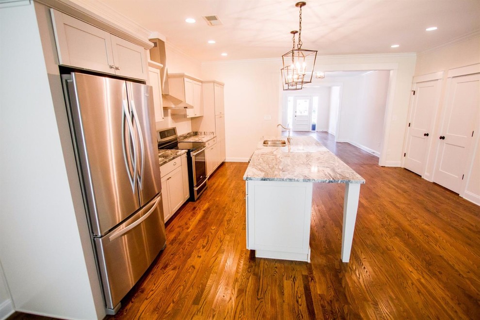 Inspiration for a large transitional single-wall dark wood floor and brown floor enclosed kitchen remodel with an undermount sink, shaker cabinets, gray cabinets, marble countertops, stainless steel appliances and an island