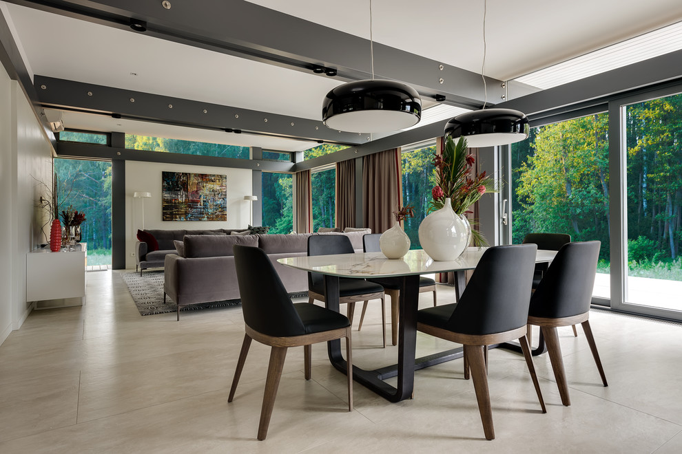 Photo of a contemporary open plan dining in Moscow with no fireplace and beige floor.