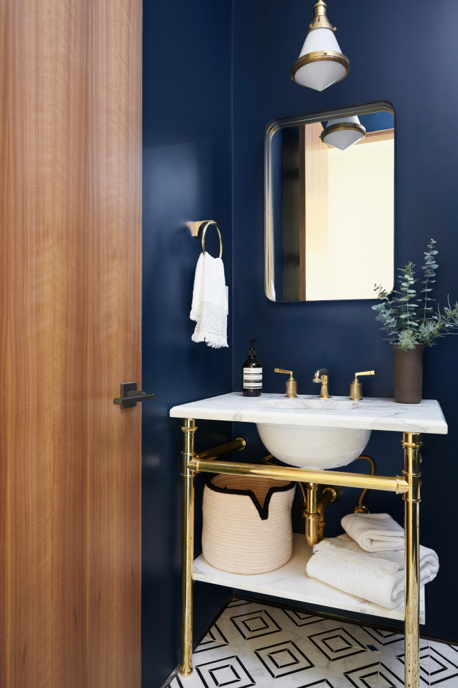 Photo of a small transitional powder room in San Francisco with open cabinets, blue walls, marble floors and marble benchtops.