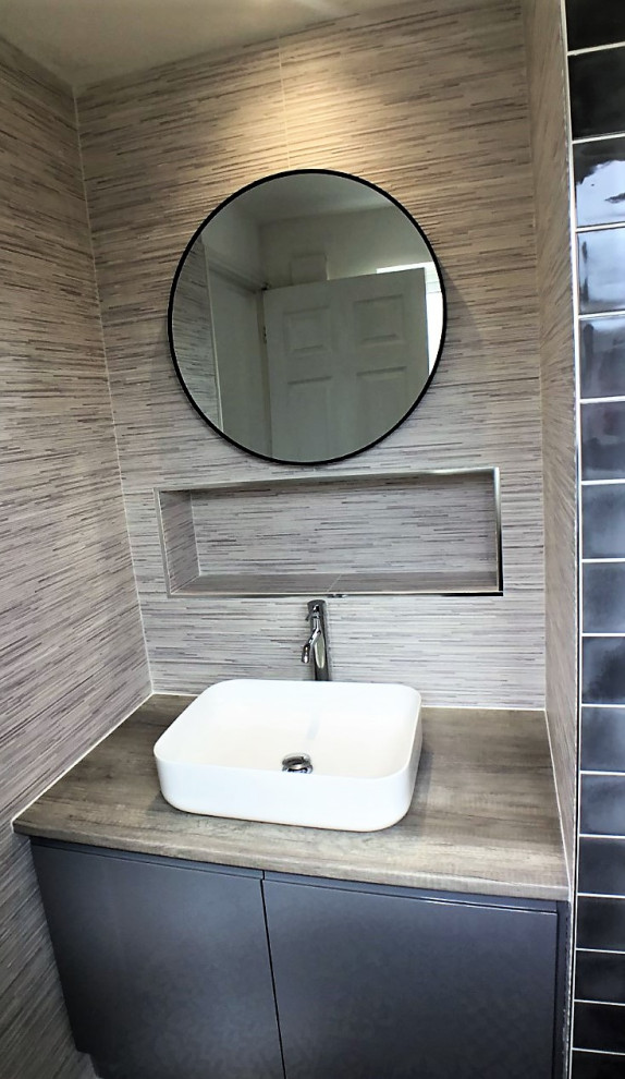Design ideas for a small modern master bathroom in Other with gray tile, porcelain floors, a vessel sink and a single vanity.
