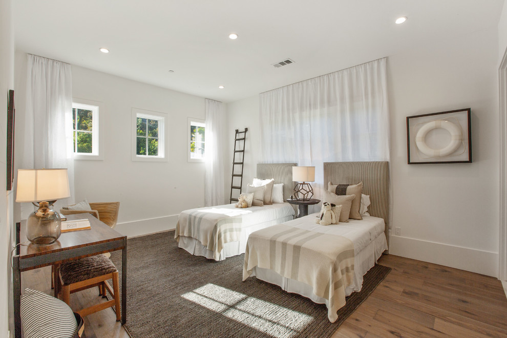 Transitional kids' bedroom in Los Angeles with white walls, medium hardwood floors and brown floor.