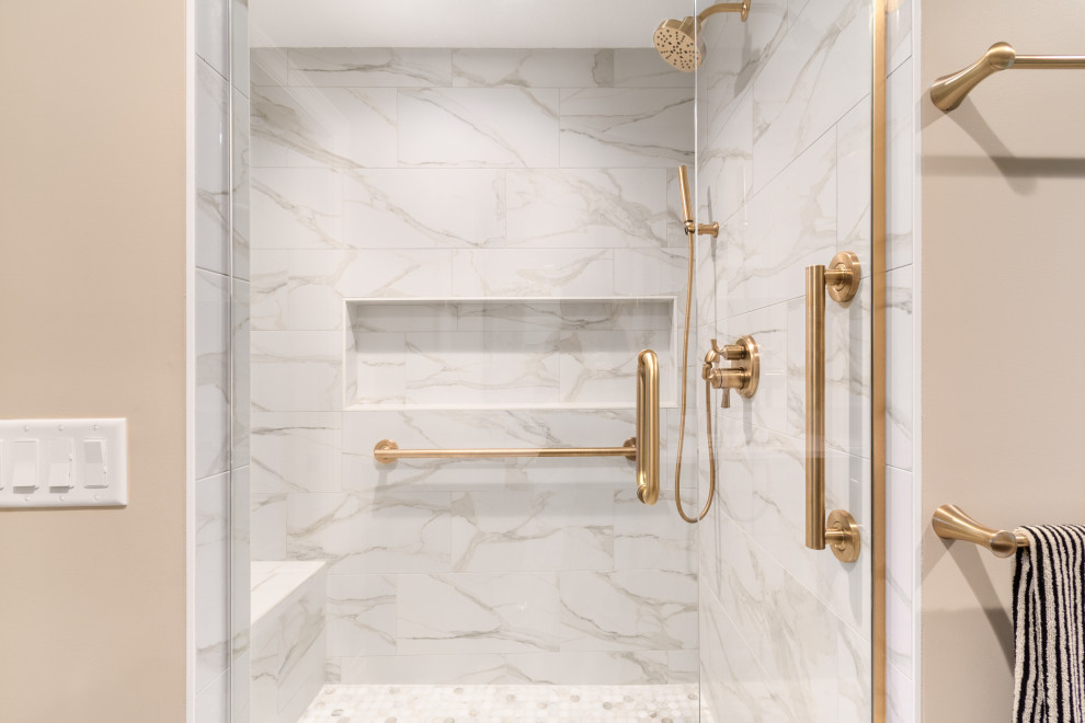 Transitional white tile and porcelain tile alcove shower photo in Minneapolis with beige walls and a hinged shower door