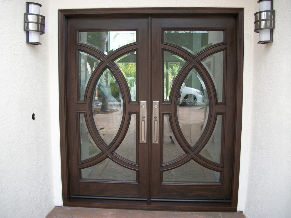 Design ideas for a mid-sized traditional front door in San Diego with white walls, travertine floors, a double front door, a dark wood front door and beige floor.