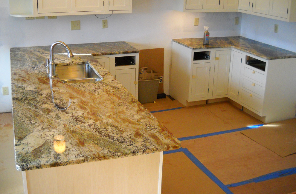 Inspiration for a kitchen in Other with granite benchtops.