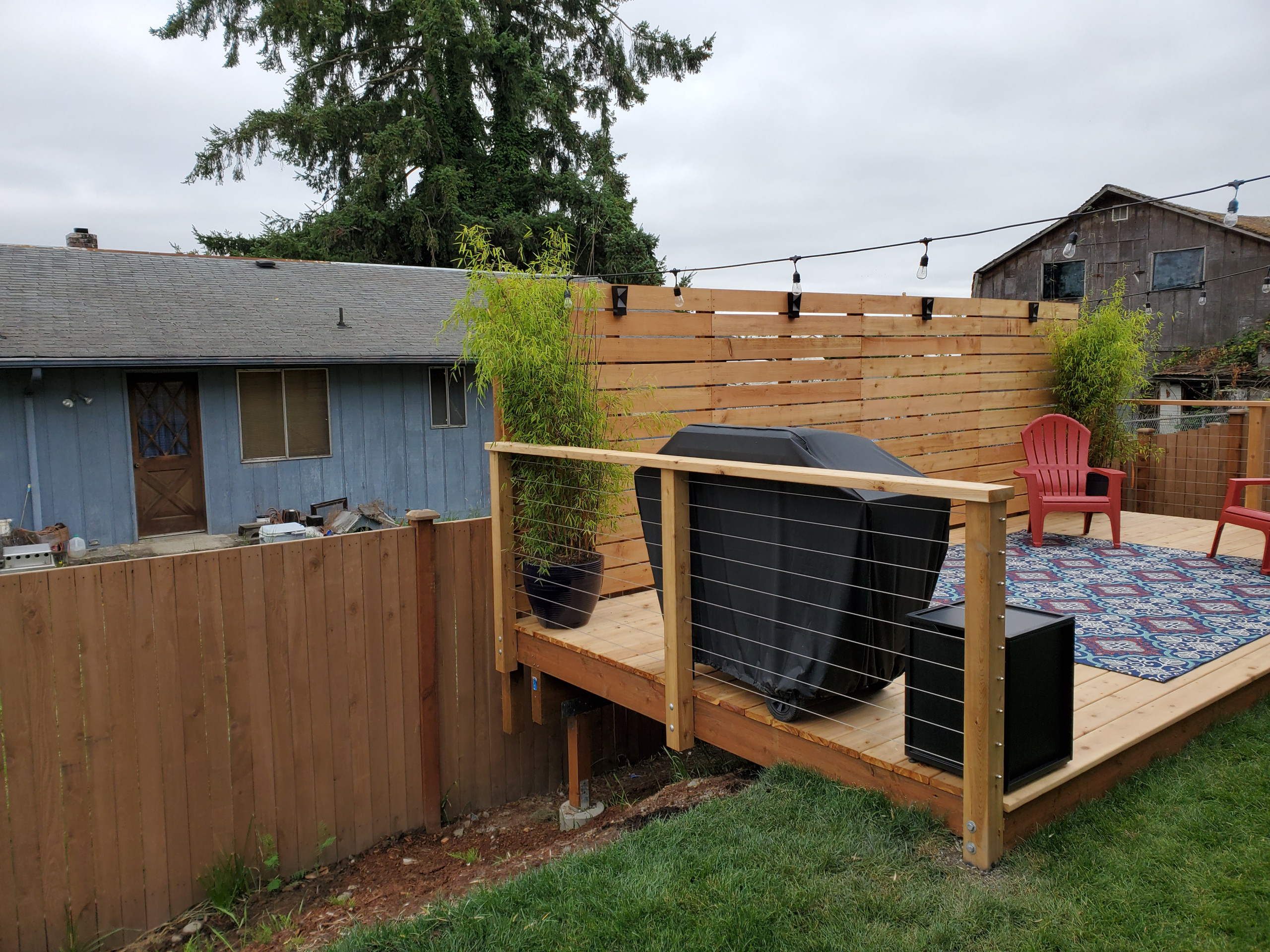 backyard deck with privacy fence/ with a low fence