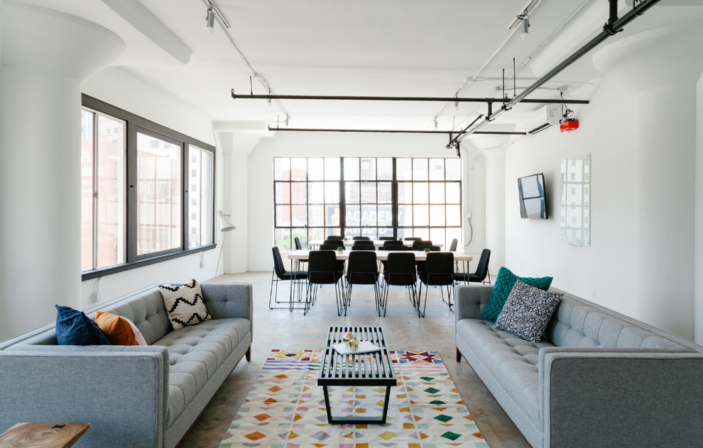 This is an example of a large contemporary loft-style living room in San Diego with white walls, linoleum floors, no fireplace, a wall-mounted tv and beige floor.
