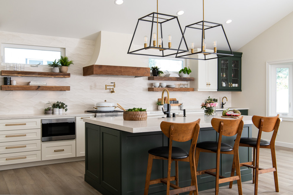 Design ideas for a transitional l-shaped eat-in kitchen in Orange County with an undermount sink, shaker cabinets, white cabinets, quartz benchtops, white splashback, stone tile splashback, stainless steel appliances, porcelain floors, with island, brown floor, white benchtop and vaulted.