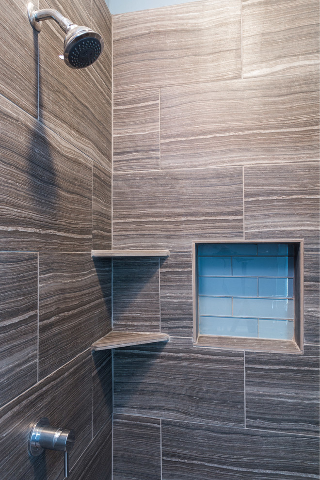 This is an example of a mid-sized modern master bathroom in Chicago with shaker cabinets, dark wood cabinets, an alcove tub, an alcove shower, a two-piece toilet, blue tile, subway tile, blue walls, ceramic floors, an undermount sink and marble benchtops.