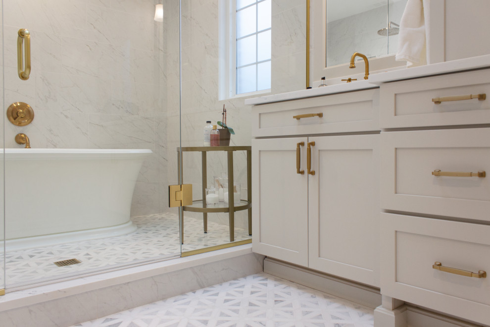 Mid-sized transitional wet room bathroom in Chicago with shaker cabinets, a freestanding tub, yellow tile, multi-coloured floor, a hinged shower door, white benchtops, an enclosed toilet, a double vanity and a built-in vanity.