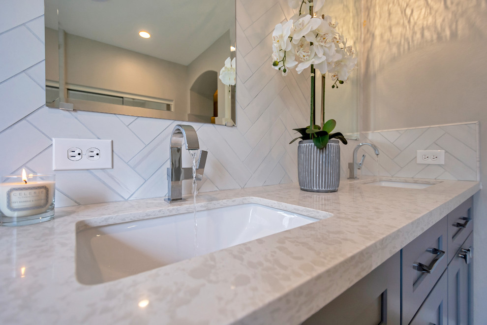 Design ideas for a mid-sized contemporary master bathroom in Phoenix with shaker cabinets, grey cabinets, a curbless shower, gray tile, an undermount sink, engineered quartz benchtops, beige floor, an open shower and white benchtops.