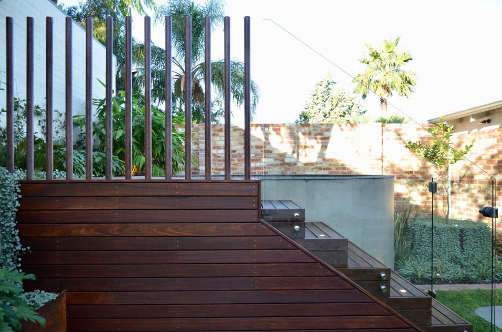 This is an example of a small modern backyard round aboveground pool in Perth with with a pool and decking.