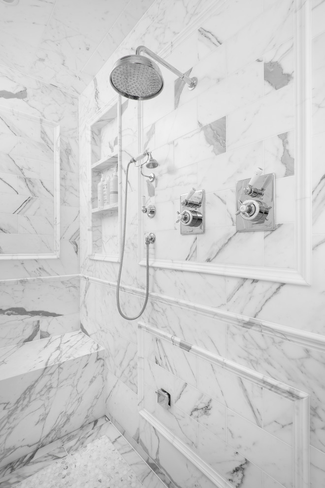Large transitional master white tile and stone tile marble floor alcove shower photo in Chicago with marble countertops