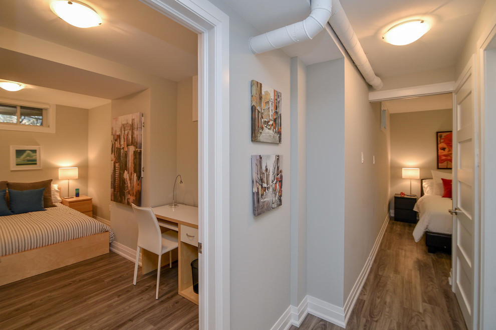 Inspiration for a mid-sized transitional medium tone wood floor and brown floor hallway remodel with gray walls