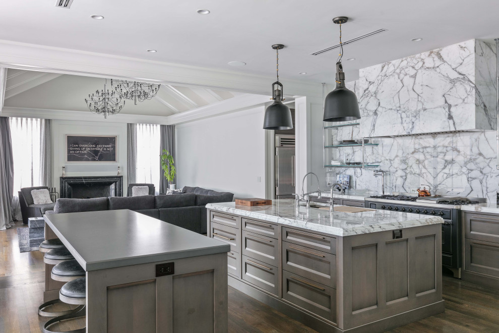 Inspiration for a large transitional dark wood floor and brown floor eat-in kitchen remodel in Orlando with brown cabinets, marble countertops, white backsplash, marble backsplash, stainless steel appliances, two islands and white countertops