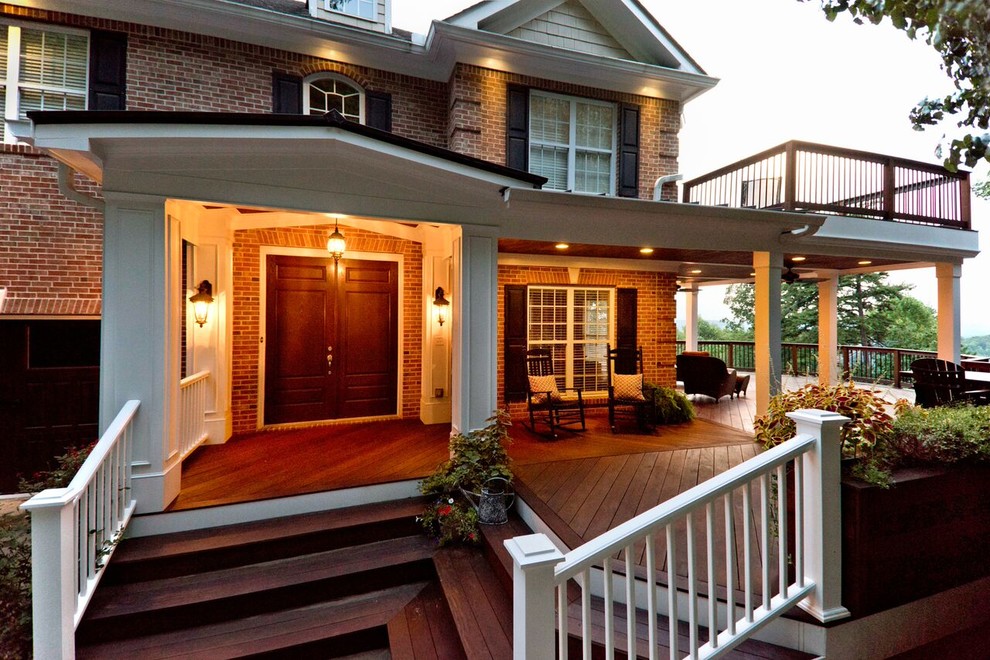 Inspiration for a large craftsman front porch remodel in Atlanta with a roof extension and decking