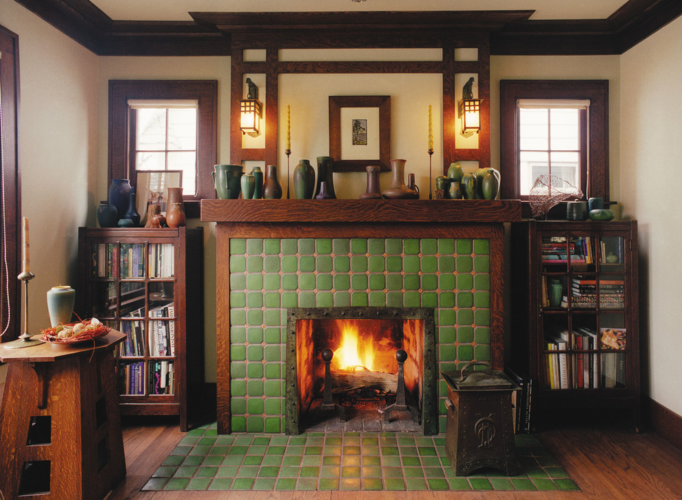 Inspiration for a mid-sized arts and crafts living room in Detroit with beige walls, medium hardwood floors, a standard fireplace, a tile fireplace surround and brown floor.