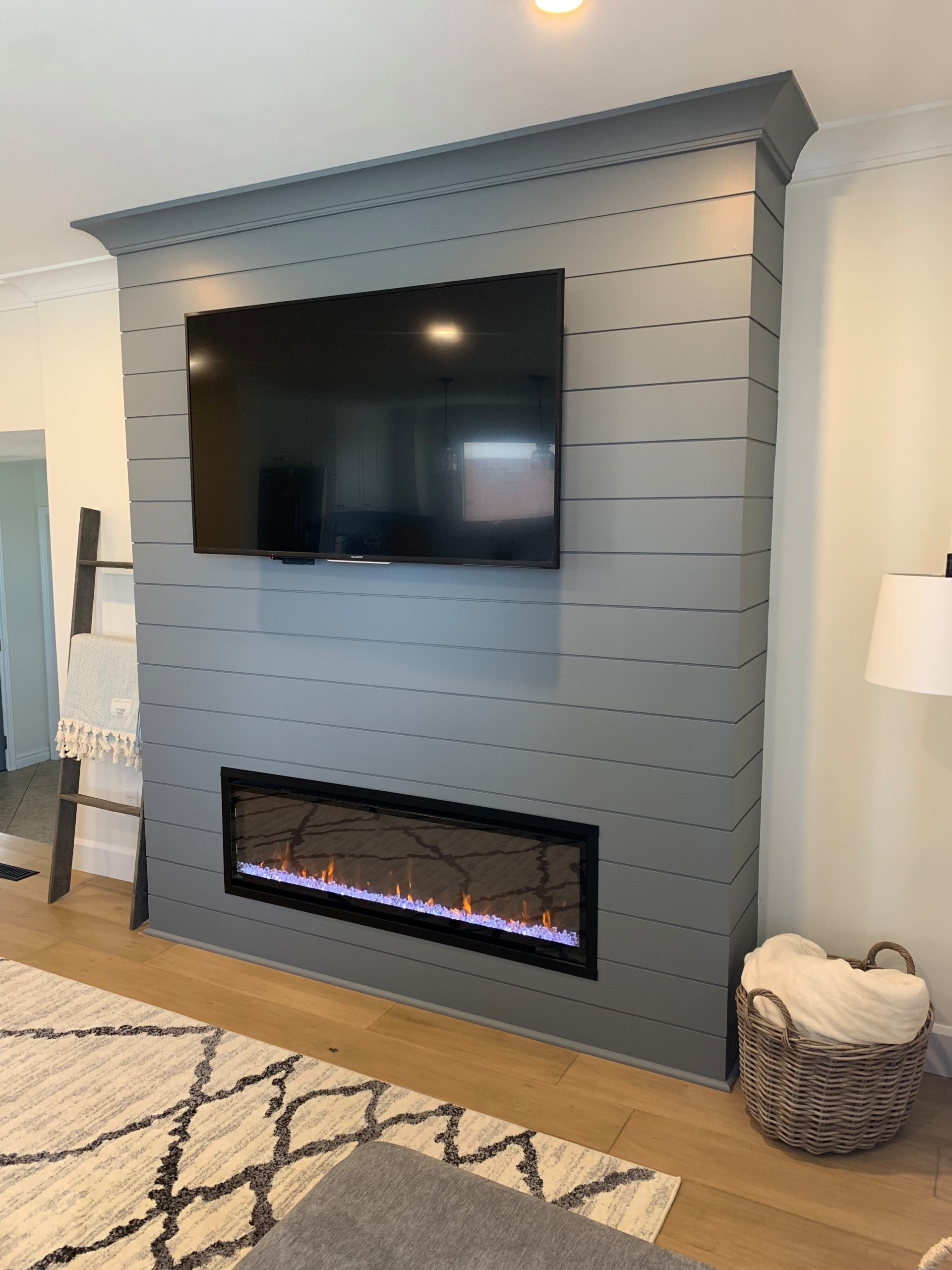 6" Wood shiplap fireplace with napoleon electric fireplace.