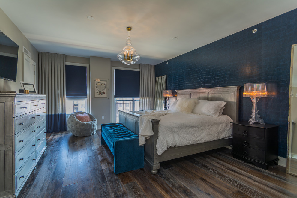 Photo of a large transitional master bedroom in New York with dark hardwood floors, grey walls, no fireplace and brown floor.
