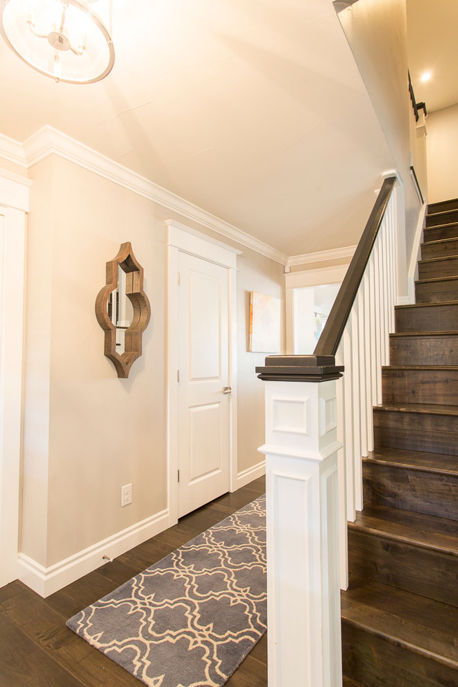 Large transitional medium tone wood floor and brown floor foyer photo in Denver with gray walls and a white front door
