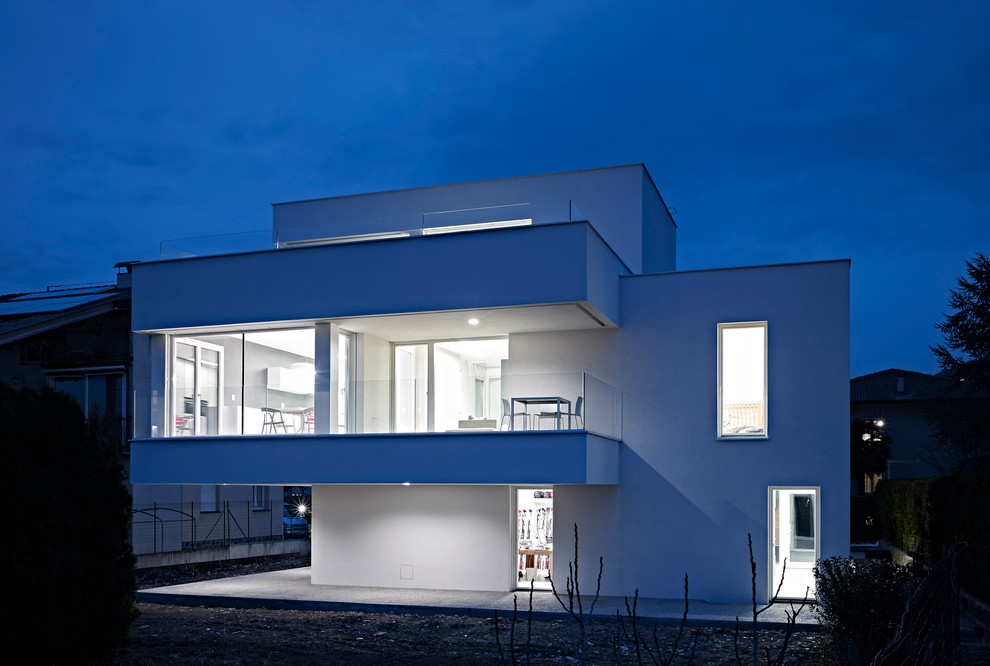 Photo of a contemporary three-storey white exterior in Other.