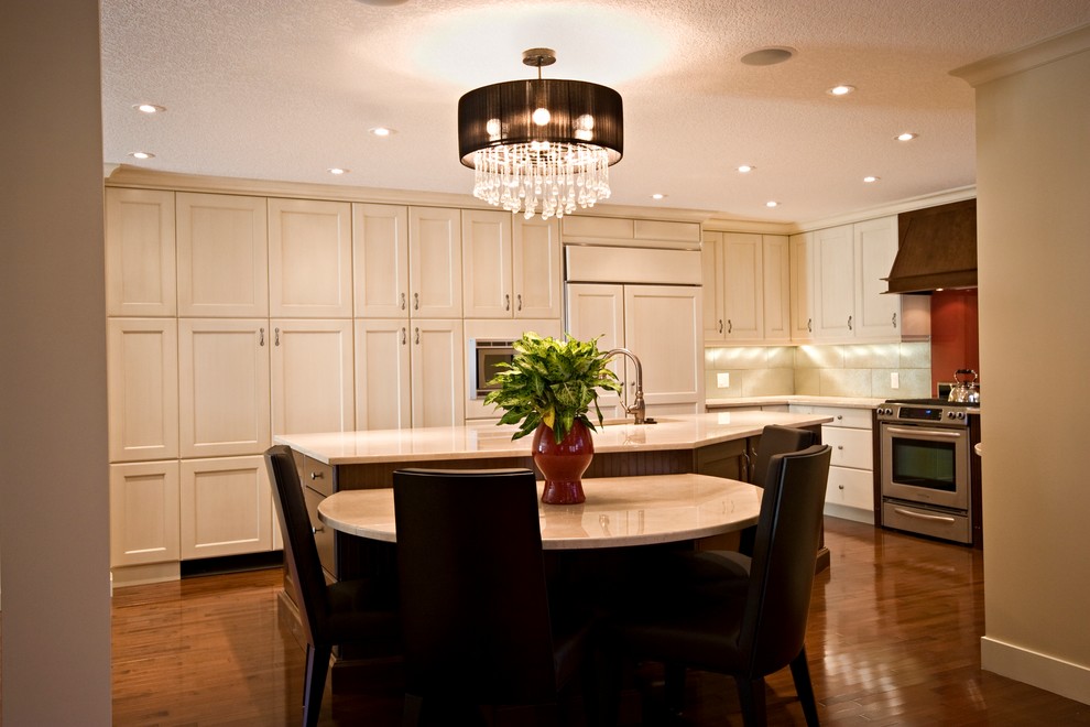 Example of a transitional kitchen design in Calgary