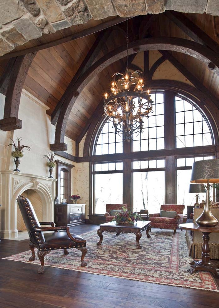 Design ideas for a traditional family room in Minneapolis with a stone fireplace surround.