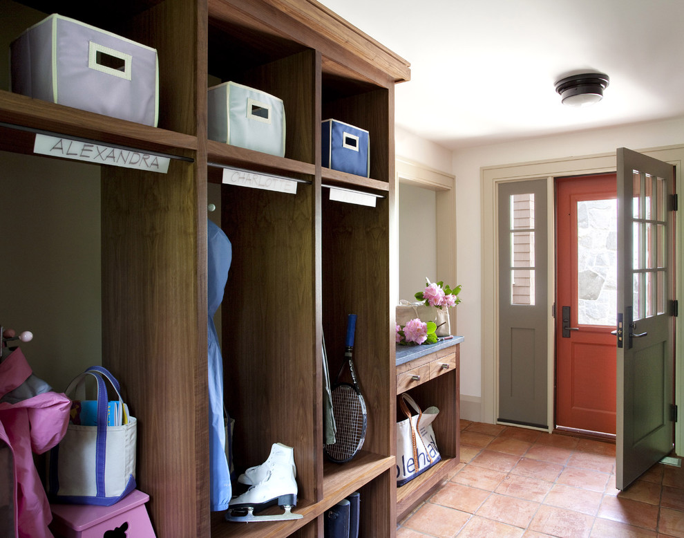 Photo of a traditional mudroom in Boston with white walls.