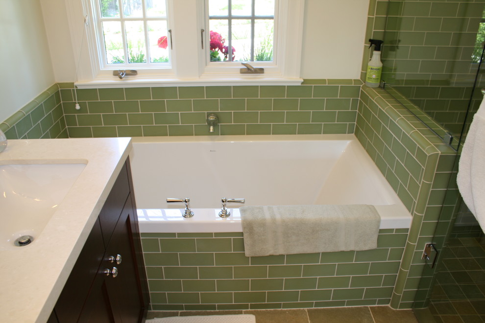 This is an example of a mid-sized traditional master bathroom in San Francisco with recessed-panel cabinets, dark wood cabinets, an alcove tub, a corner shower, green tile and white walls.