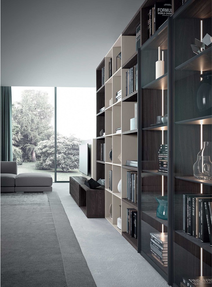 Inspiration for a large modern loft-style living room in Milan with a library and concrete floors.