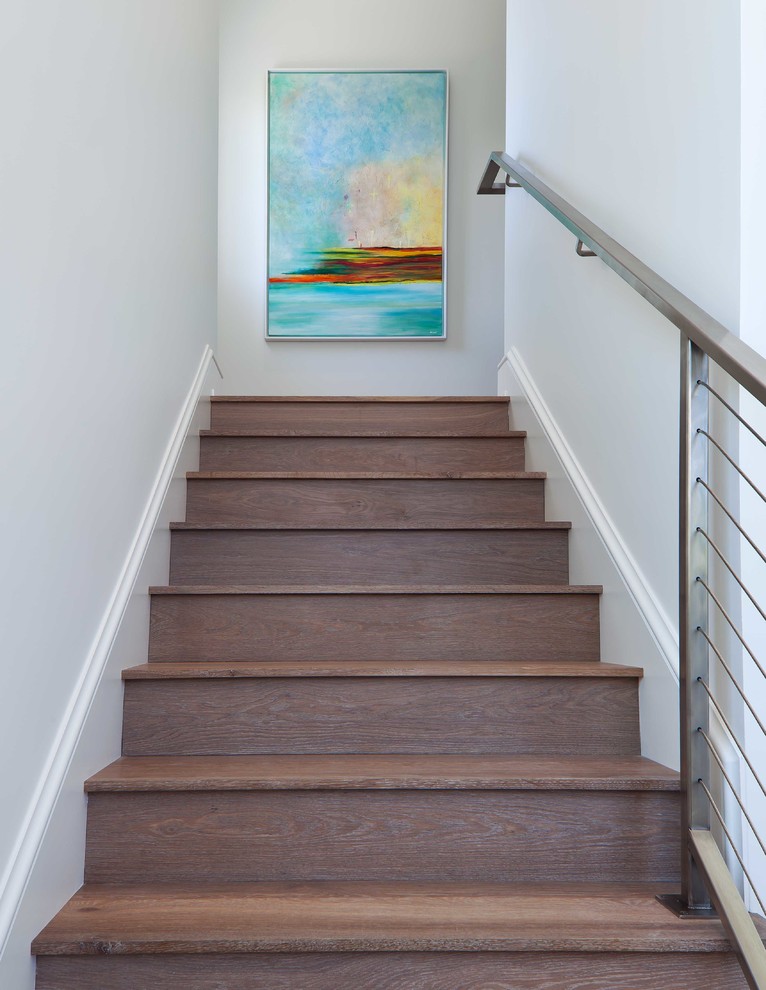 Staircase - mid-sized transitional wooden u-shaped staircase idea in Miami with wooden risers