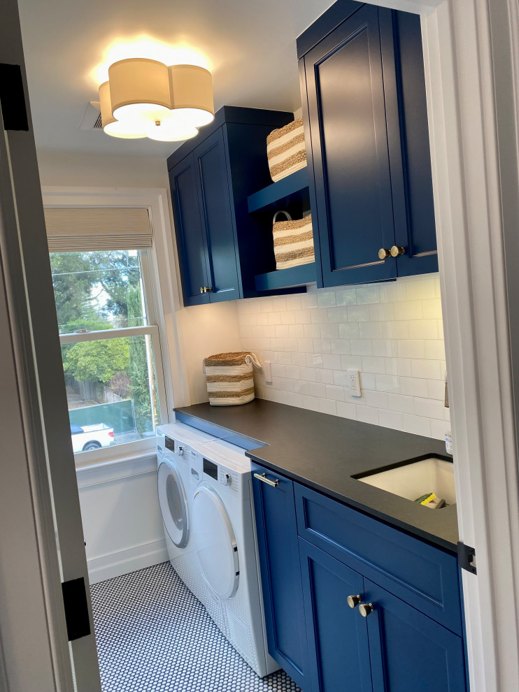 This is an example of a small classic utility room in Other with a submerged sink, beaded cabinets, blue cabinets, granite worktops, white splashback, ceramic splashback, white walls, ceramic flooring, a side by side washer and dryer and multi-coloured floors.