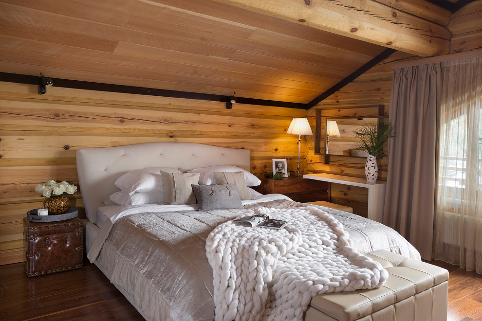 Photo of a bedroom in Moscow with brown floor, wood and wood walls.