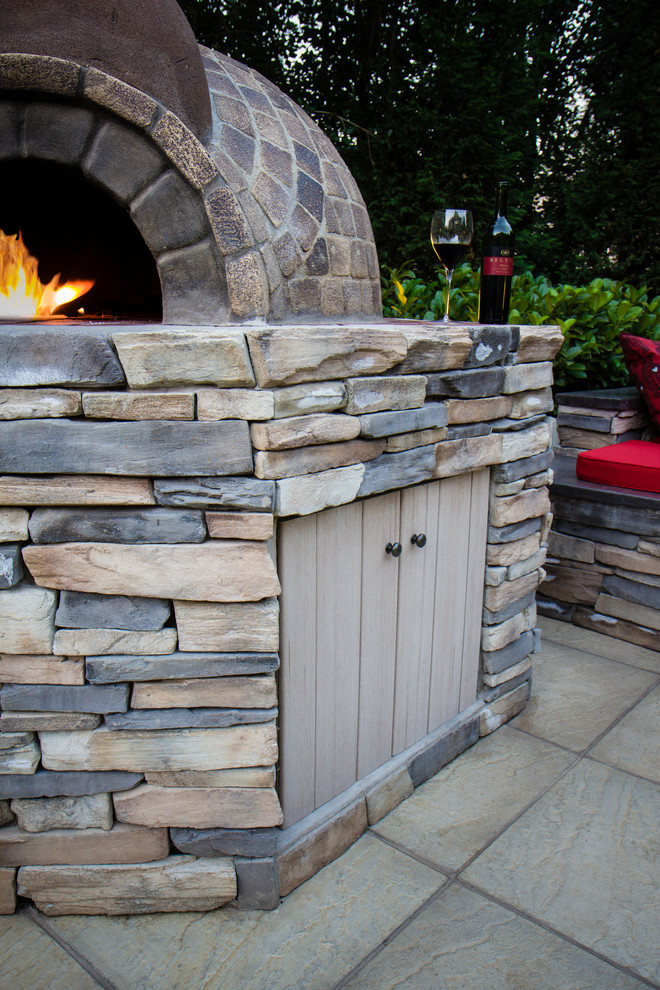 Inspiration for a rustic full sun backyard concrete paver landscaping.