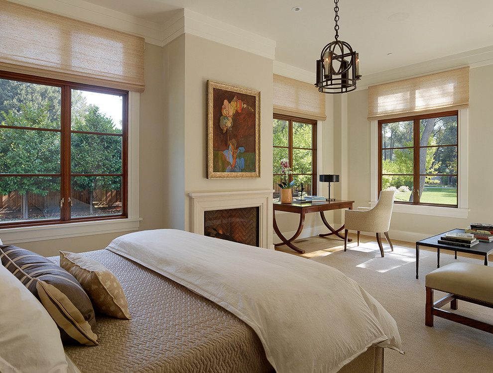 Transitional bedroom photo in San Francisco with beige walls and a standard fireplace