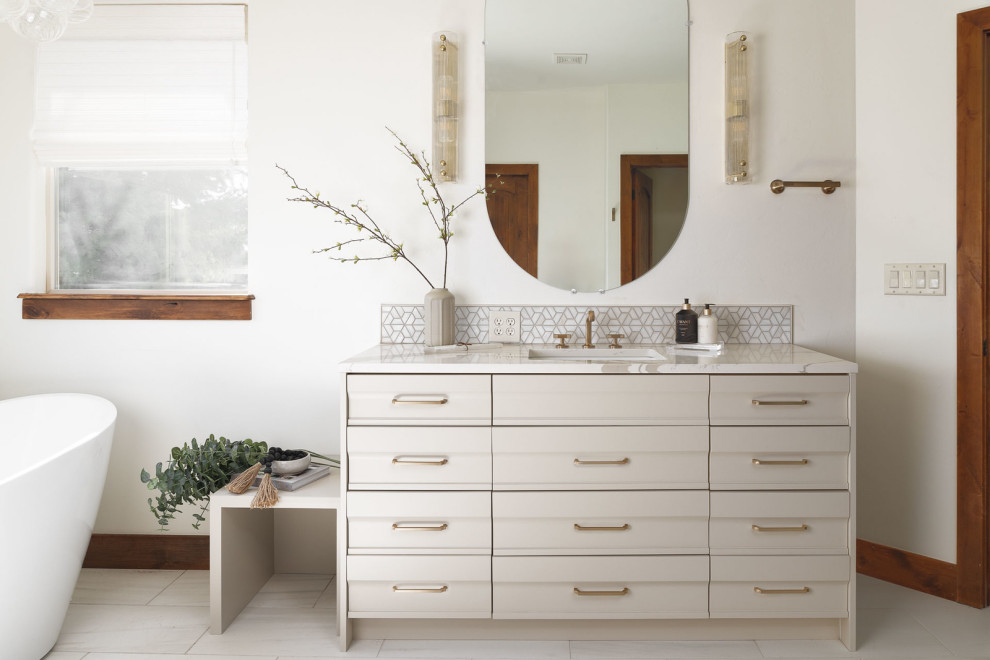 Example of a transitional home design design in Denver