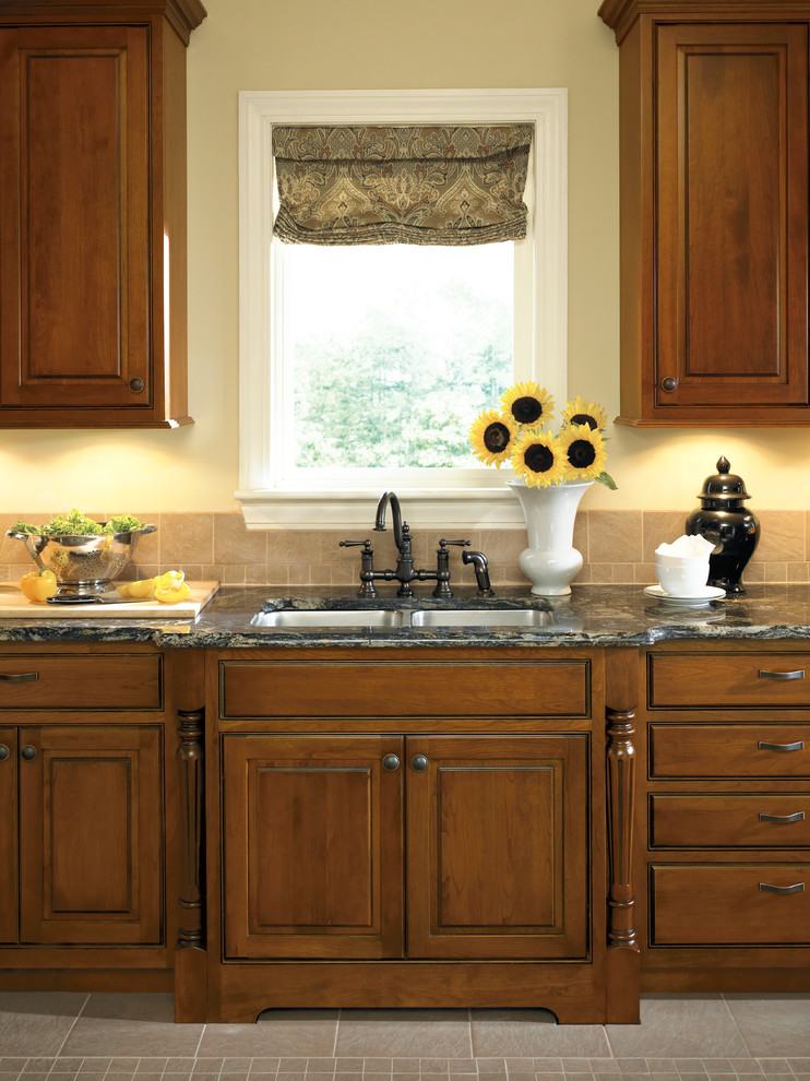 Photo of a traditional kitchen in Other with a double-bowl sink and granite benchtops.