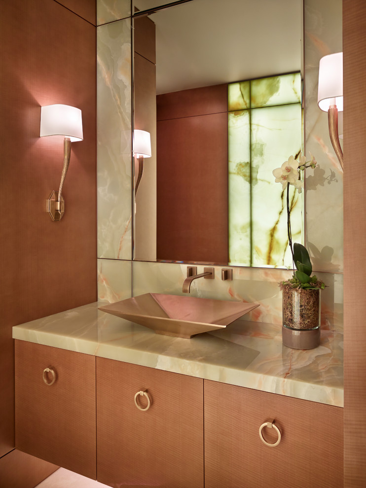 This is an example of a contemporary powder room in Seattle with flat-panel cabinets, light wood cabinets and a vessel sink.