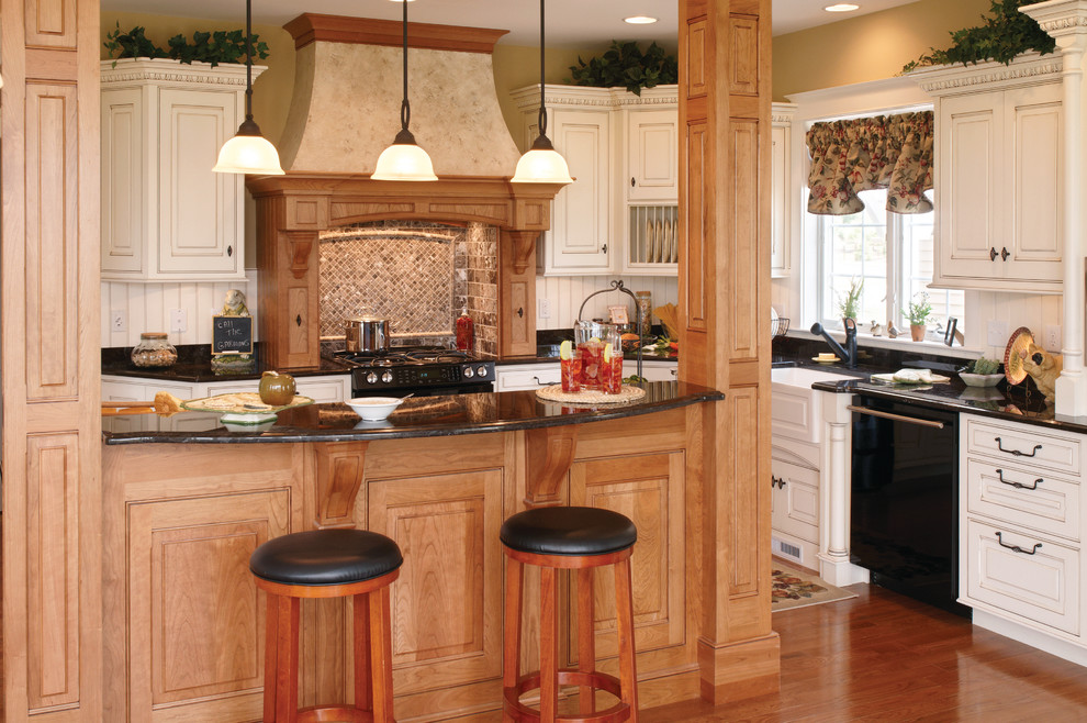 Example of a mid-sized transitional u-shaped medium tone wood floor eat-in kitchen design with medium tone wood cabinets, white backsplash and an island