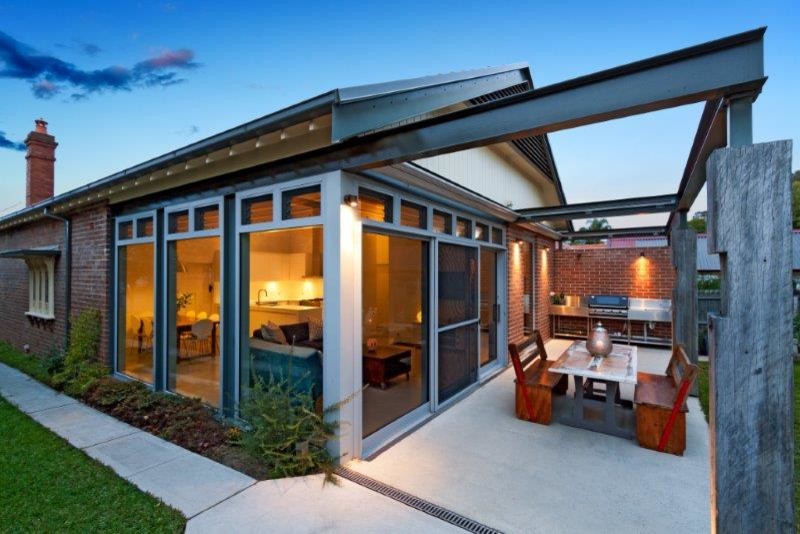 Design ideas for a small contemporary one-storey brick red exterior in Sydney.