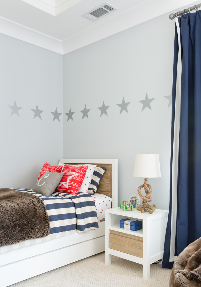 Design ideas for a mid-sized transitional kids' bedroom for kids 4-10 years old and boys in San Francisco with grey walls, carpet and white floor.