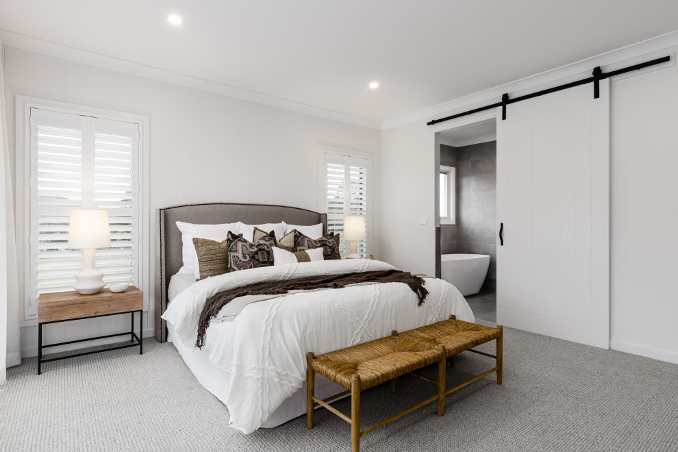 Inspiration for a large contemporary master bedroom in Wollongong with white walls, carpet, grey floor and panelled walls.