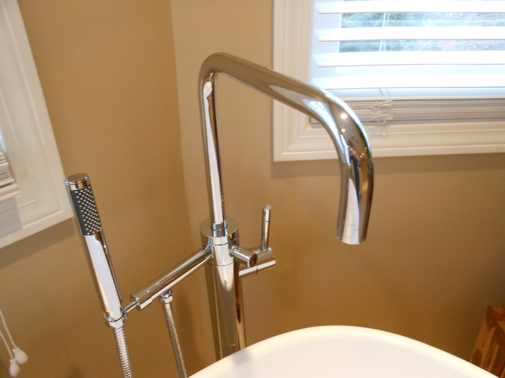Example of a transitional master freestanding bathtub design in Boston