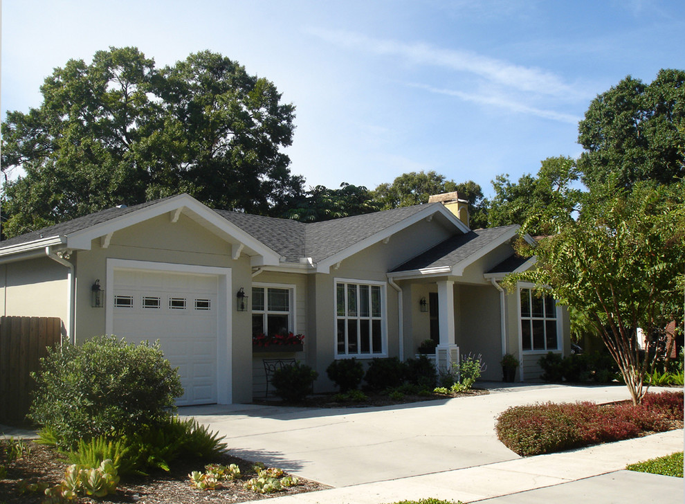 Small arts and crafts one-storey grey exterior in Tampa with mixed siding and a gable roof.