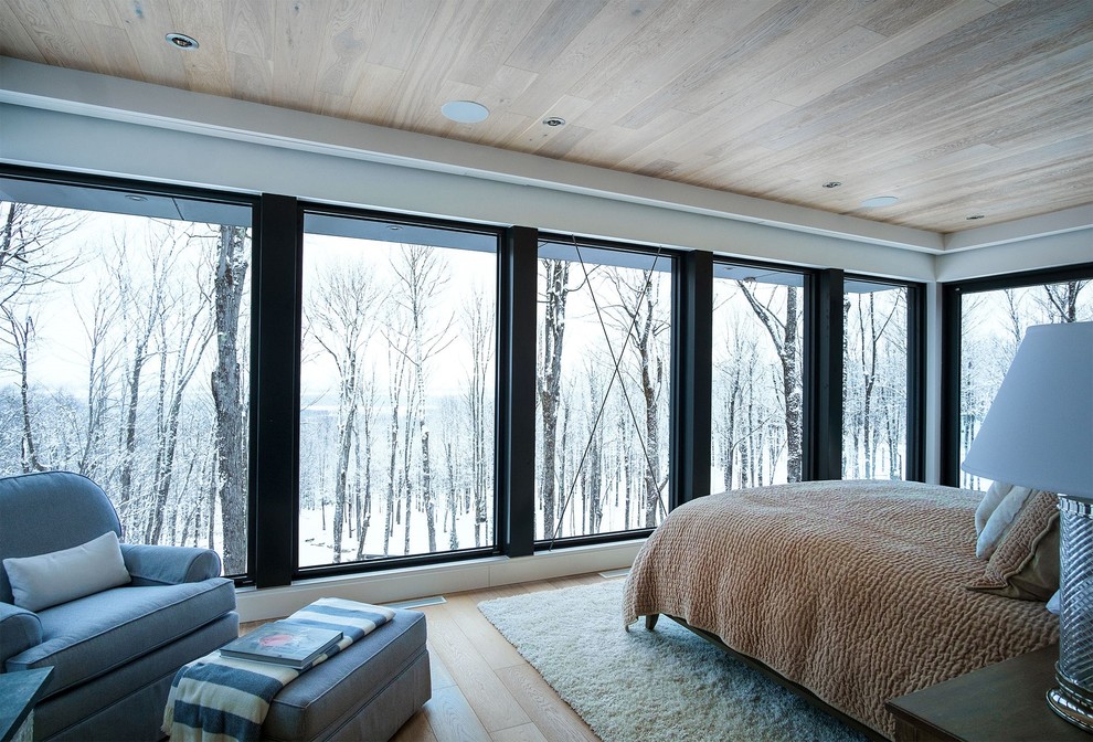Photo of a country bedroom in Montreal.